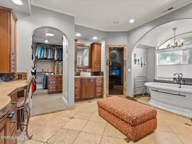 a kitchen with stainless steel appliances kitchen island granite countertop a table and chairs