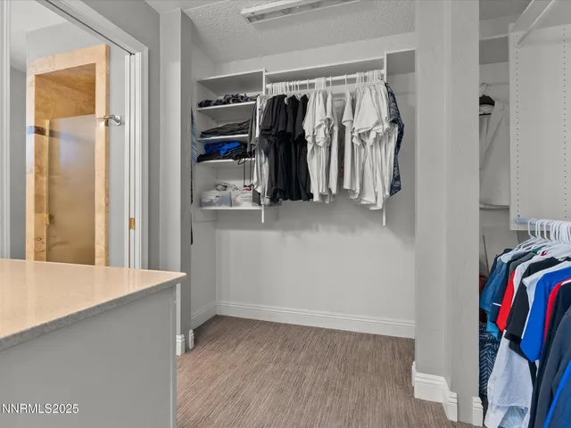 a view of a house with a yard covered in snow