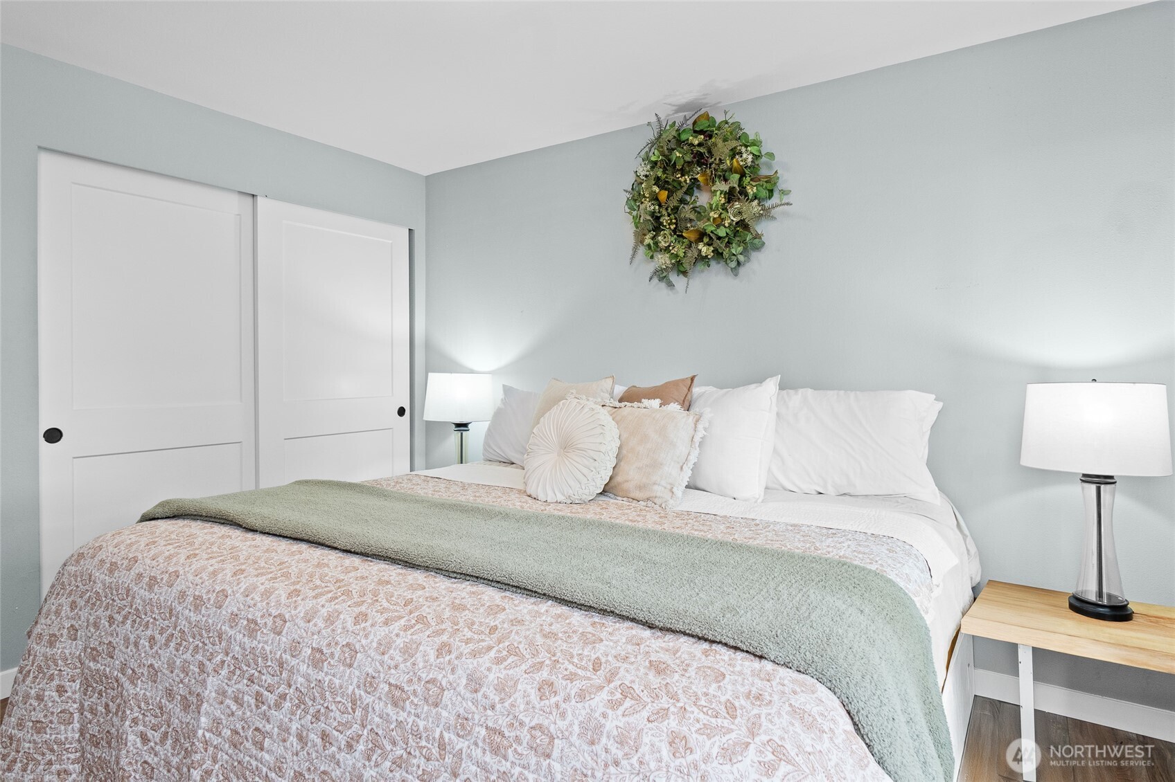 16115 243rd Street East Graham, WA 98338 - Photo 12 of 38 a bedroom with a bed and a lamp