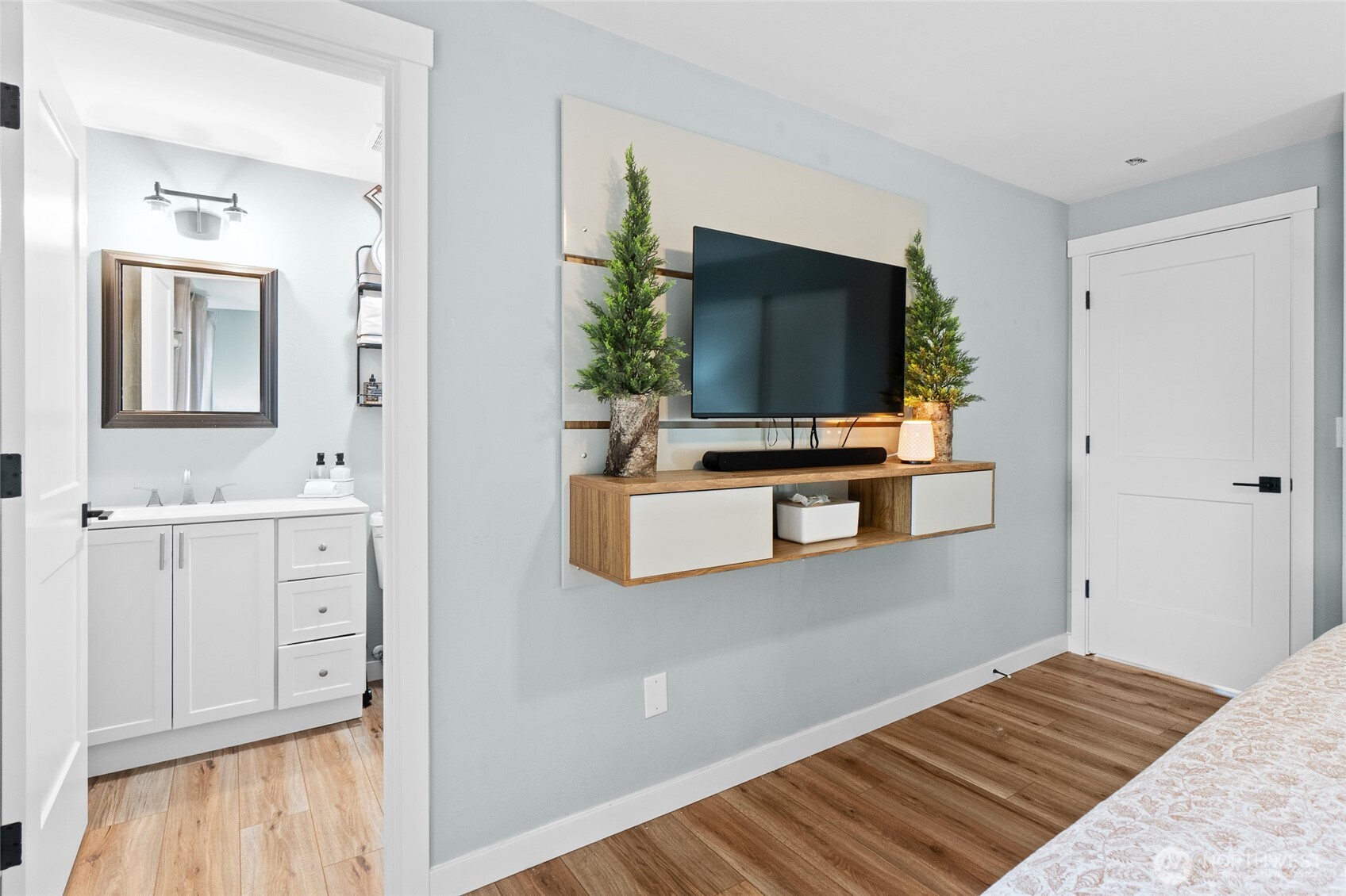 16115 243rd Street East Graham, WA 98338 - Photo 13 of 38 a bedroom with wooden floor and flat screen tv