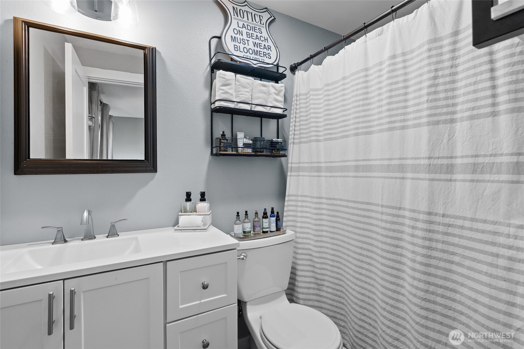 16115 243rd Street East Graham, WA 98338 - Photo 14 of 38 a bathroom with a toilet sink and mirror