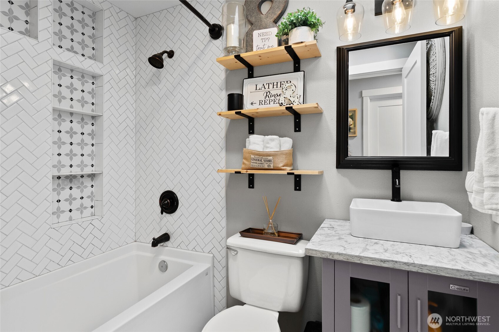 16115 243rd Street East Graham, WA 98338 - Photo 16 of 38 a bathroom with a granite countertop sink mirror toilet and bathtub