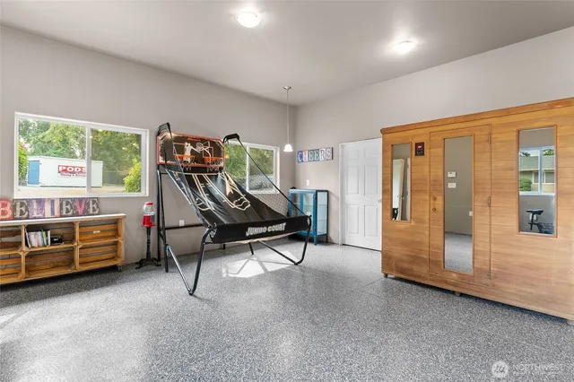 a bedroom with furniture and a window