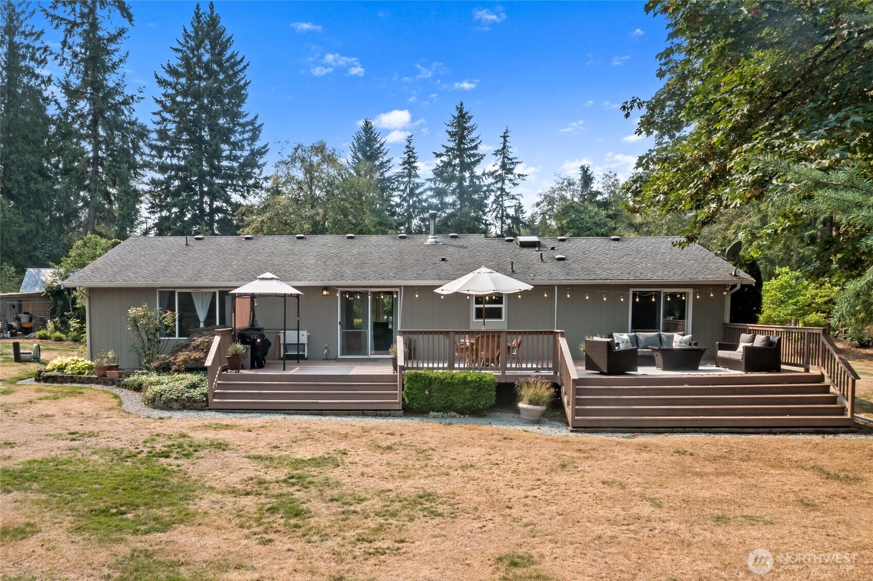 16115 243rd Street East Graham, WA 98338 - Photo 23 of 38 a front view of a house with a yard