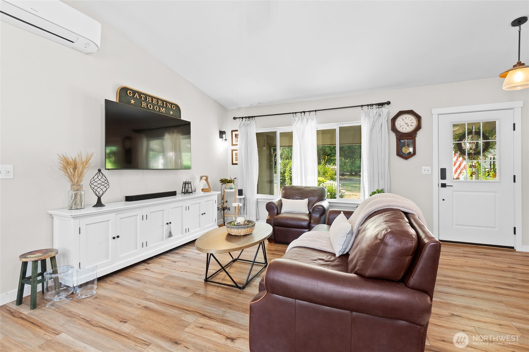 16115 243rd Street East Graham, WA 98338 - Photo 3 of 38 a living room with furniture and a flat screen tv