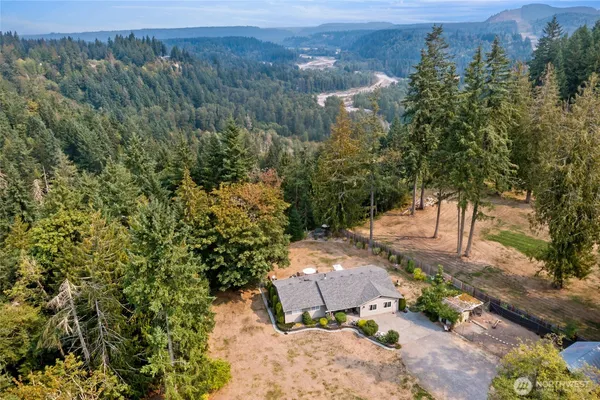 an aerial view of a house with a yard