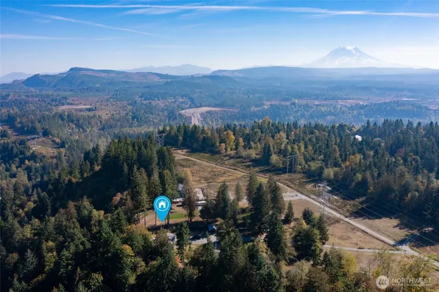 a view of a street with a mountain in the background