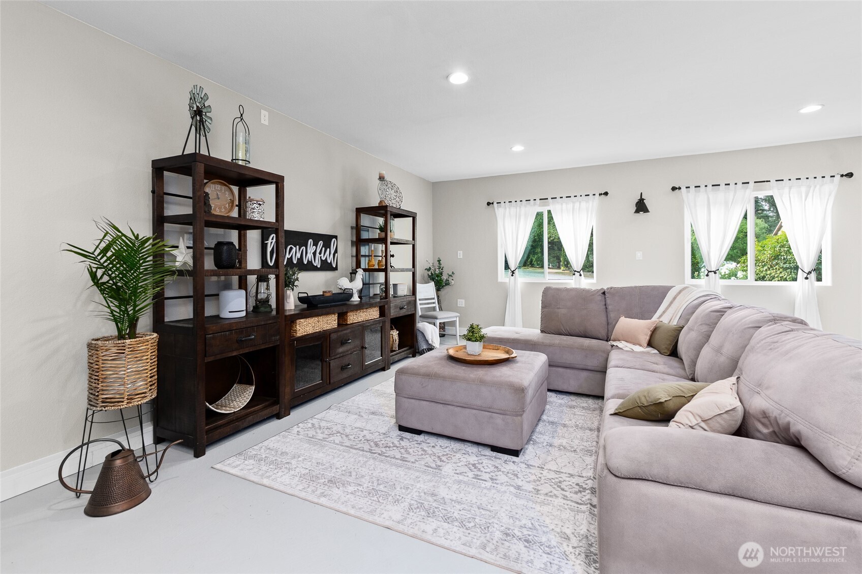 16115 243rd Street East Graham, WA 98338 - Photo 8 of 38 a living room with furniture flat screen tv and window