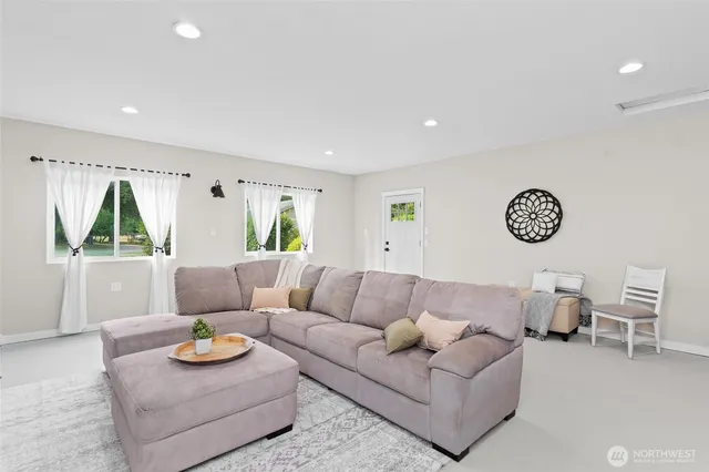 a living room with furniture and a table