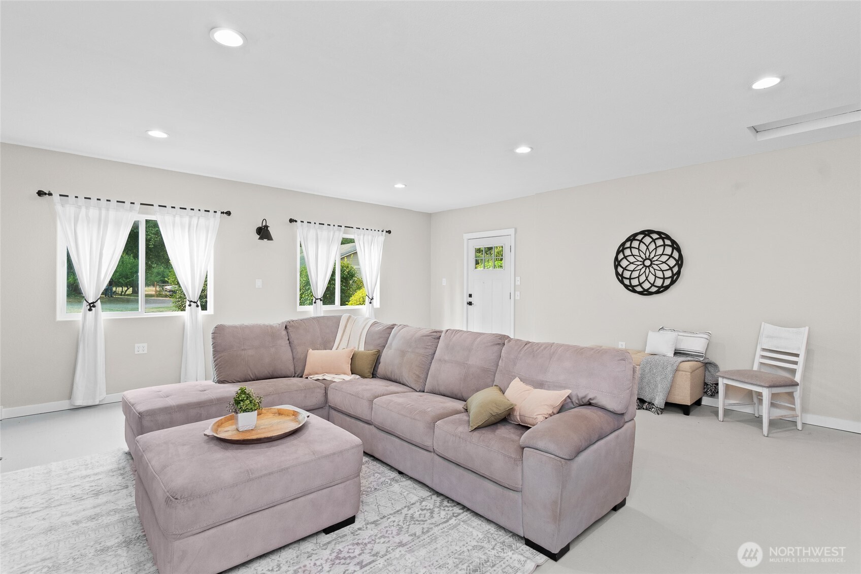 16115 243rd Street East Graham, WA 98338 - Photo 9 of 38 a living room with furniture and a table