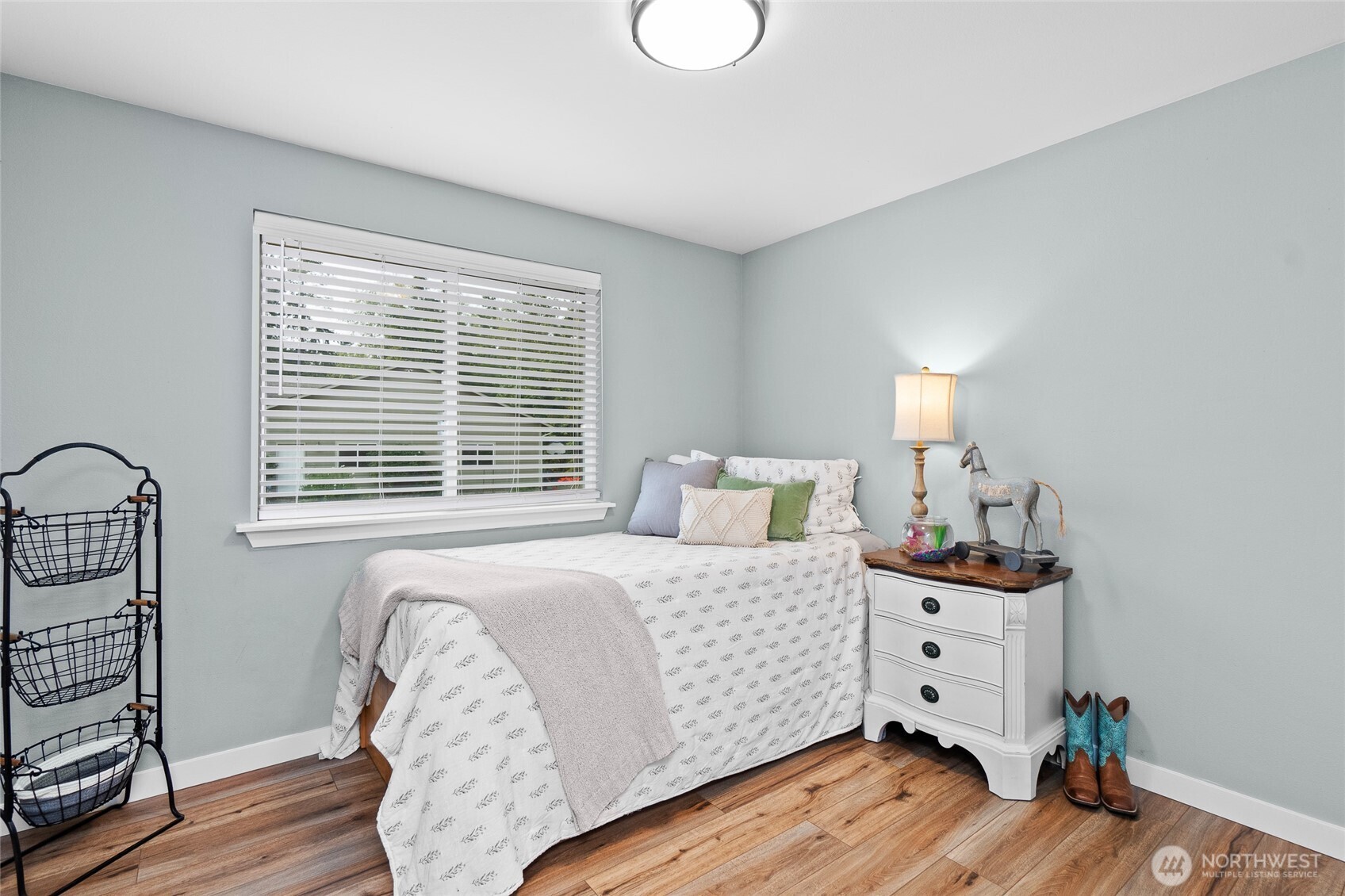 16115 243rd Street East Graham, WA 98338 - Photo 10 of 38 a bedroom with a bed and wooden floor