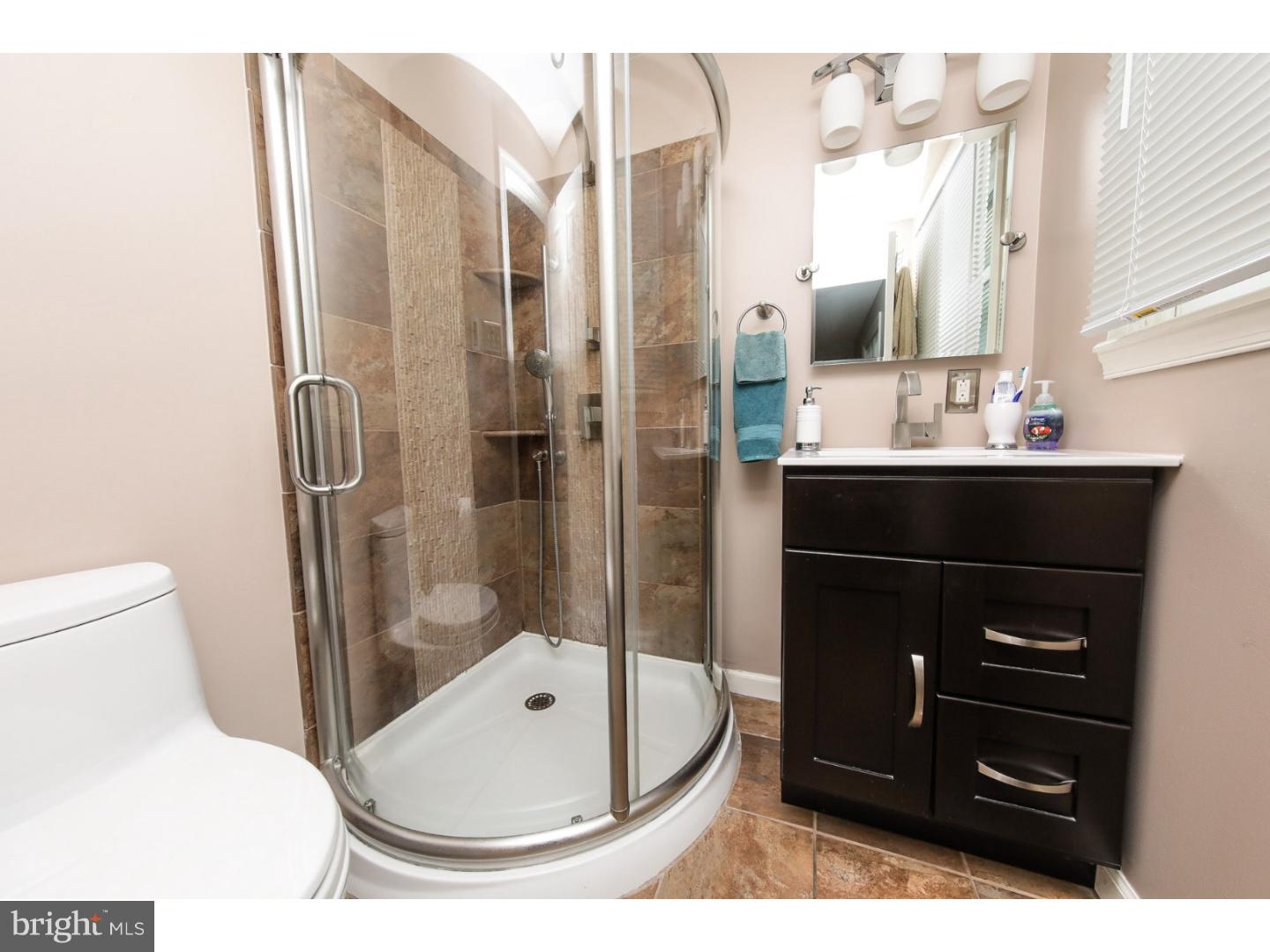 754 Spruce Road Warminster, PA 18974 - Photo 17 of 25 a bathroom with a sink a toilet and shower