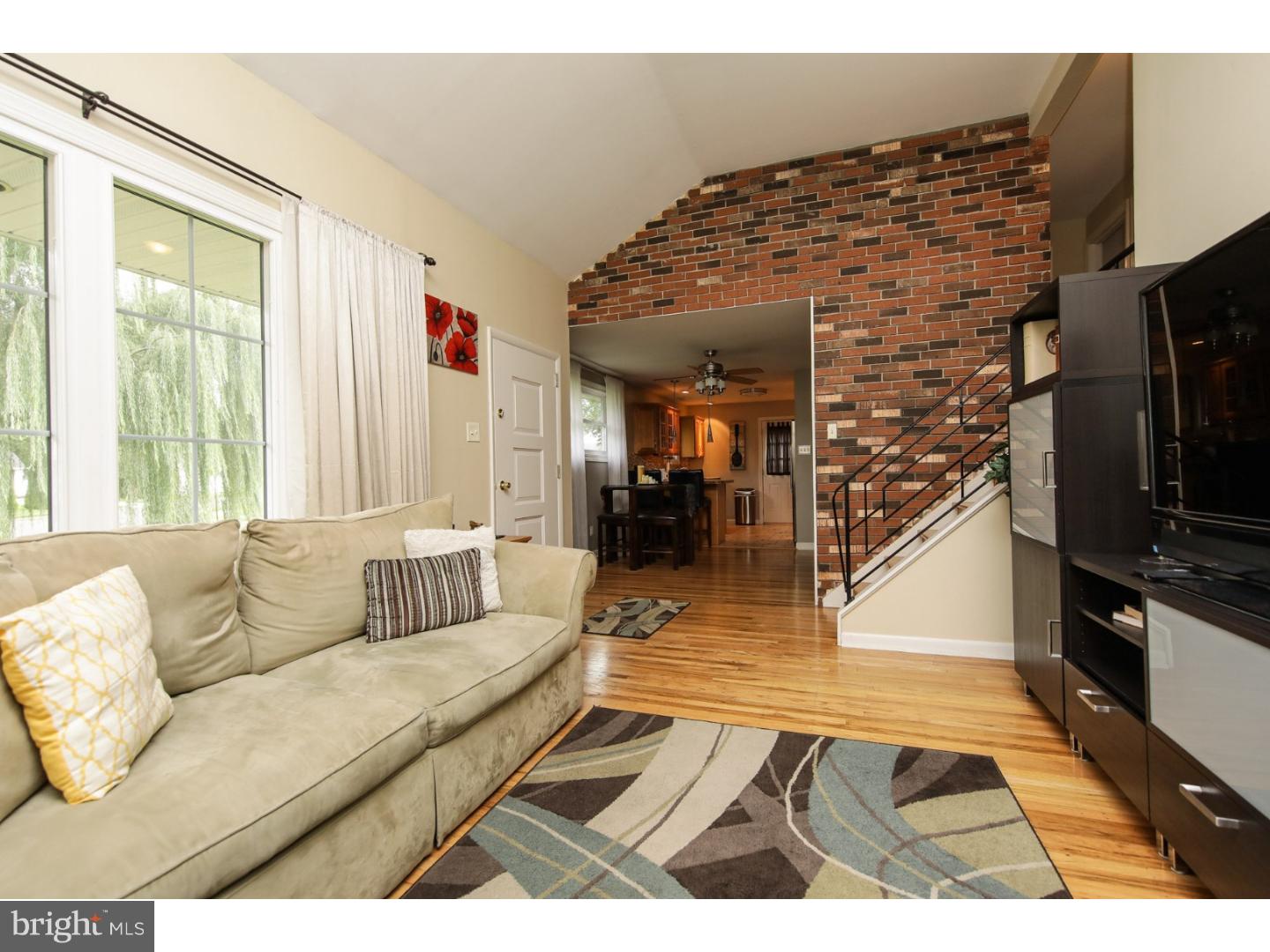 754 Spruce Road Warminster, PA 18974 - Photo 6 of 25 a living room with furniture and a flat screen tv