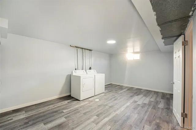 an empty room with wooden floor