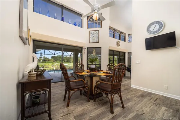 a view of a dining room with furniture window and outside view