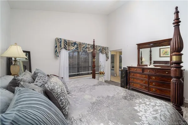 a bed room with a bed and a television