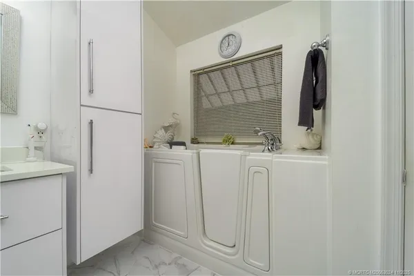 a bathroom with a sink and mirror