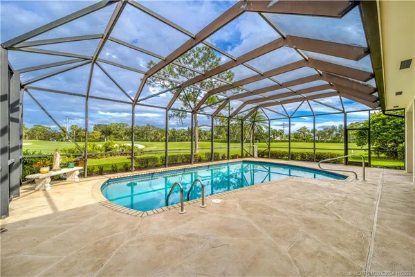 a view of a swimming pool with a backyard