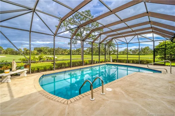 a view of a swimming pool with a patio