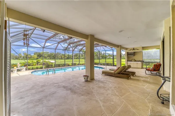 a view of a room with gym equipment and floor to ceiling window