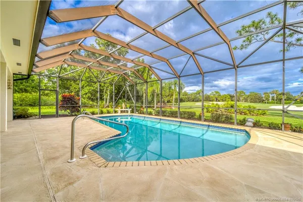 a view of a swimming pool with a patio