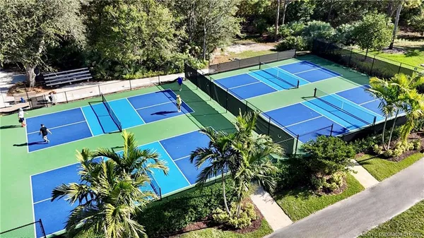 a very nice looking living room with furniture and chandelier