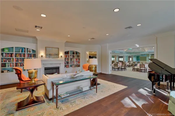 a very nice looking living room with furniture and a large window
