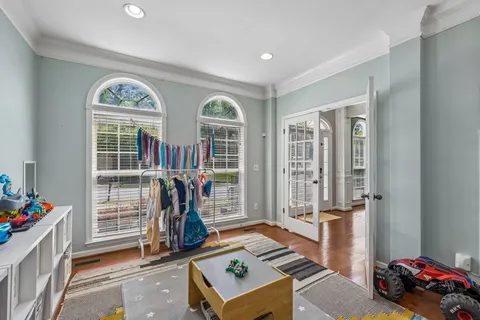 a kitchen with stainless steel appliances granite countertop a sink a stove and a refrigerator