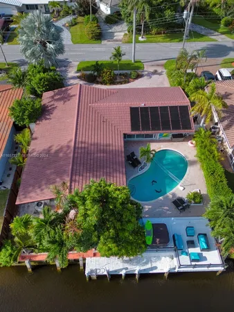 a aerial view of a house with a garden and plants