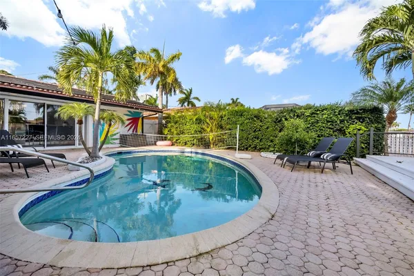 a view of a swimming pool with a patio