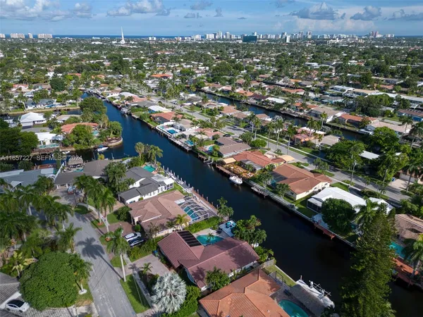 an aerial view of house with a yard