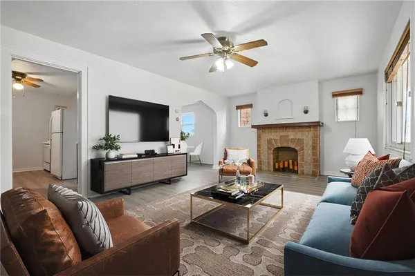 a living room with furniture and a fireplace