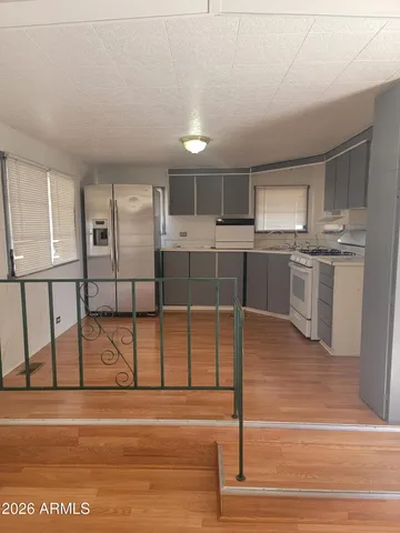 a view of backyard with large trees