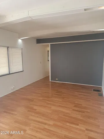a view of livingroom with an empty space and window
