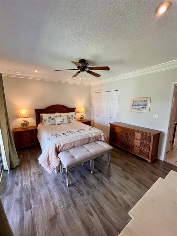 1951 Northeast 39th Street, Unit 361 Lighthouse Point, FL 33064 - Photo 12 of 27 a bedroom with a bed and a night stand