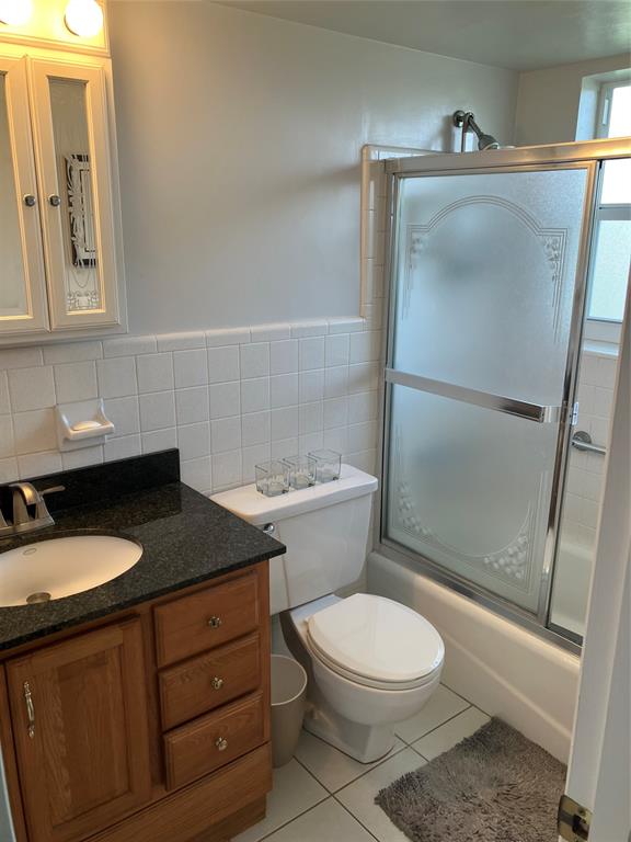 1951 Northeast 39th Street, Unit 361 Lighthouse Point, FL 33064 - Photo 13 of 27 a bathroom with a granite countertop sink toilet and shower