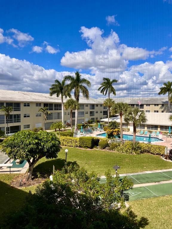 1951 Northeast 39th Street, Unit 361 Lighthouse Point, FL 33064 - Photo 18 of 27 a view of a lake with a building in the background