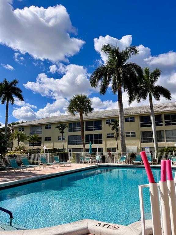 1951 Northeast 39th Street, Unit 361 Lighthouse Point, FL 33064 - Photo 21 of 27 a view of a swimming pool with a patio