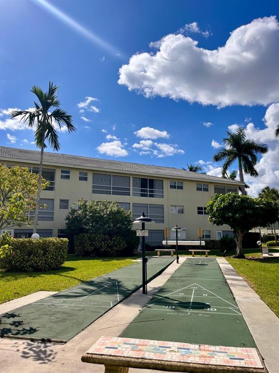 1951 Northeast 39th Street, Unit 361 Lighthouse Point, FL 33064 - Photo 24 of 27 a view of a house with swimming pool yard and a yard