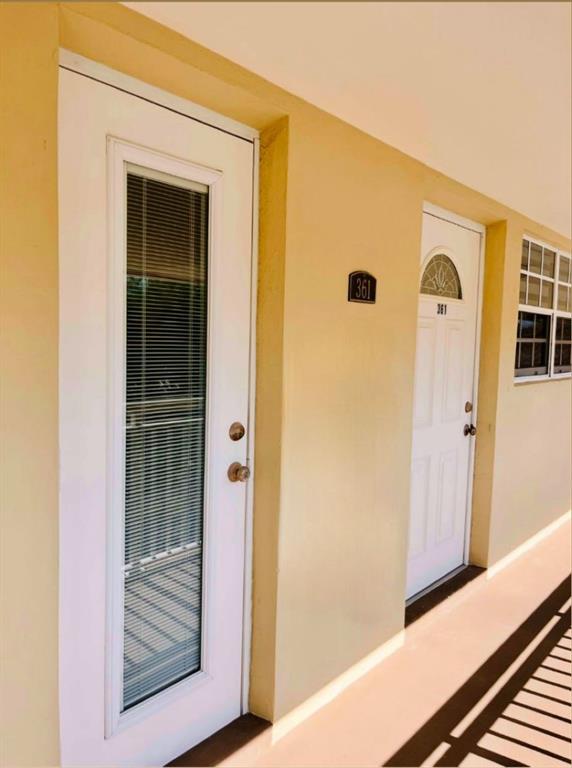 1951 Northeast 39th Street, Unit 361 Lighthouse Point, FL 33064 - Photo 25 of 27 a view of front door of a house