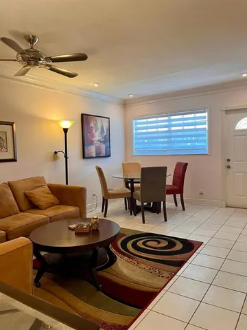 a living room with furniture and a table