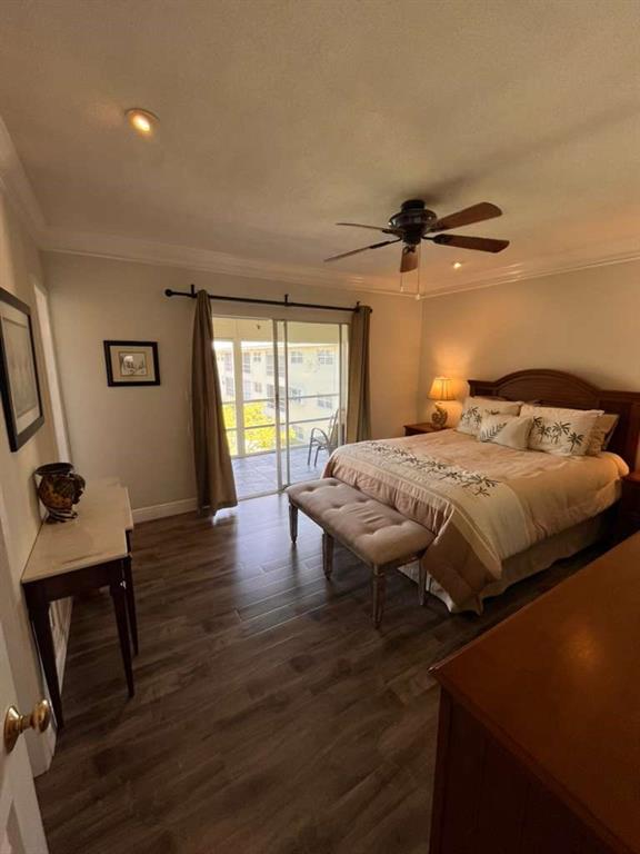 1951 Northeast 39th Street, Unit 361 Lighthouse Point, FL 33064 - Photo 10 of 27 a bedroom that has a bed and a chair in it