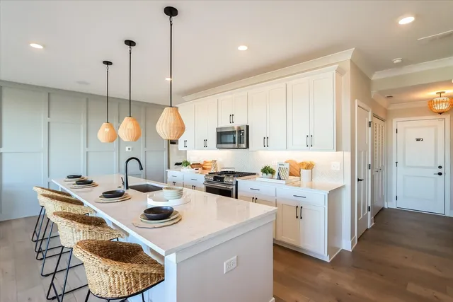 a kitchen with a sink a counter space and appliances