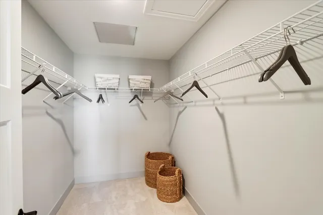 a view of entryway with racks on the wall