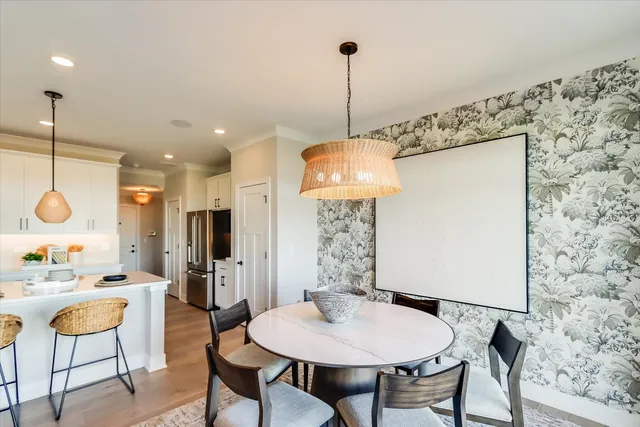 a very nice looking dining room with a table and chairs