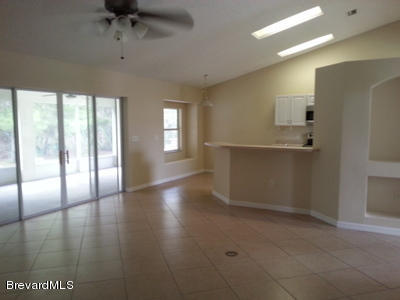 4470 Windsor Court Mims, FL 32754 - Photo 4 of 14 living room_and_view_of_kitchen