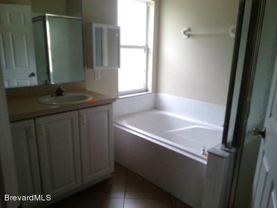 4470 Windsor Court Mims, FL 32754 - Photo 9 of 14 master_bathroom