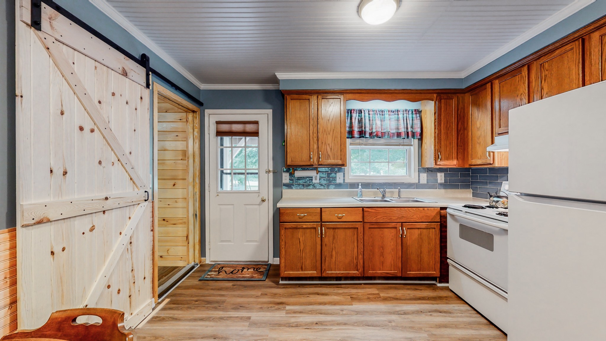 1243 White Road Bon Aqua, TN 37025 - Photo 12 of 42 a kitchen with granite countertop a stove a sink and a refrigerator