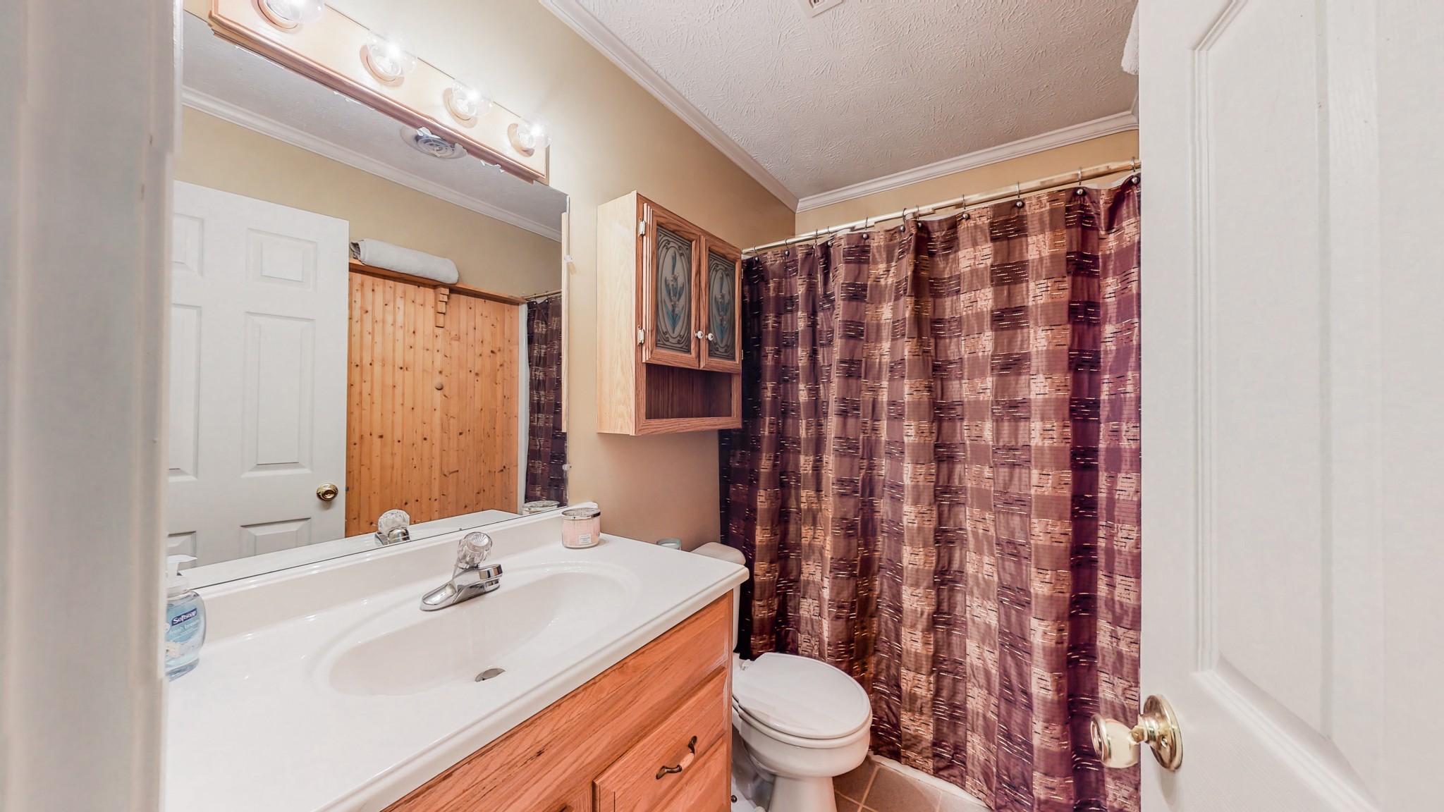 1243 White Road Bon Aqua, TN 37025 - Photo 19 of 42 a bathroom with a sink toilet and shower