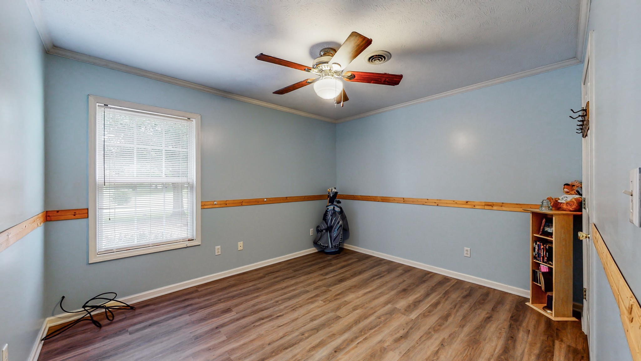 1243 White Road Bon Aqua, TN 37025 - Photo 21 of 42 a view of a room with wooden floor and fan